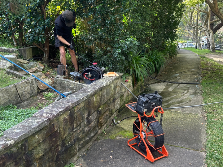 plumber inspecting separate sewer and stormwater drainage systems